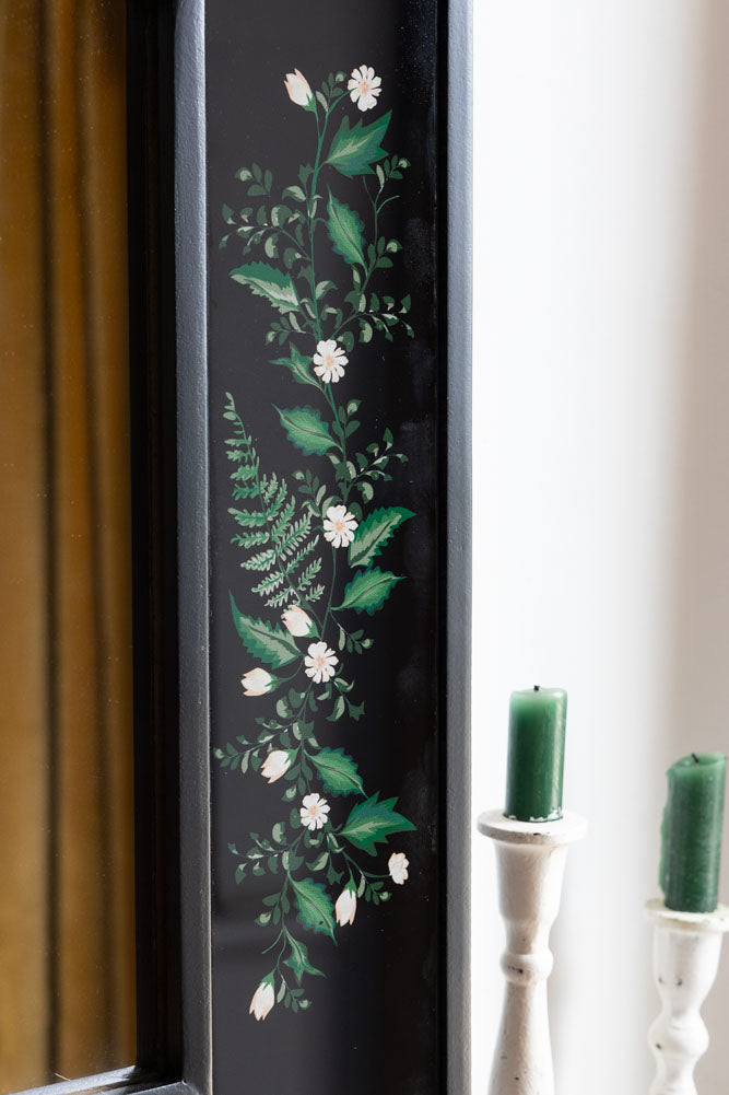 Miroir encadré en bois noir et floral
