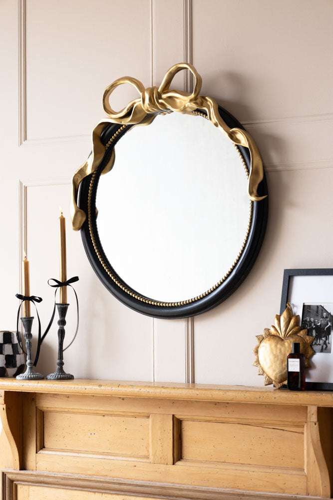 Miroir mural rond avec nœud noir et or